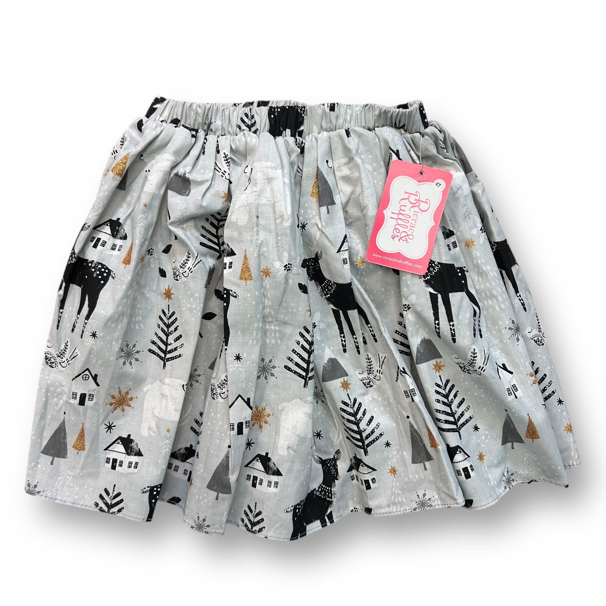 A gray Christmas-themed boutique skirt for girls with ricrac and ruffles, featuring reindeer and holiday motifs.