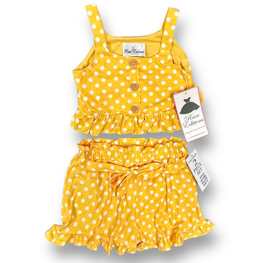 Girls Rare Editions size 4T white and yellow polka dot cropped 2-piece outfit, with the top and skirt displayed in front of its packaging.