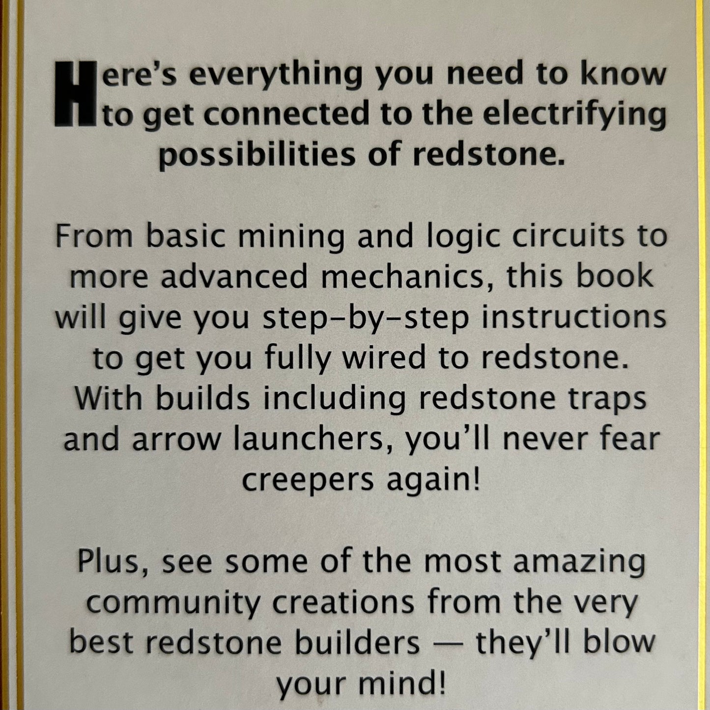 Text advertisement for a book on redstone mechanics with a gold border.
