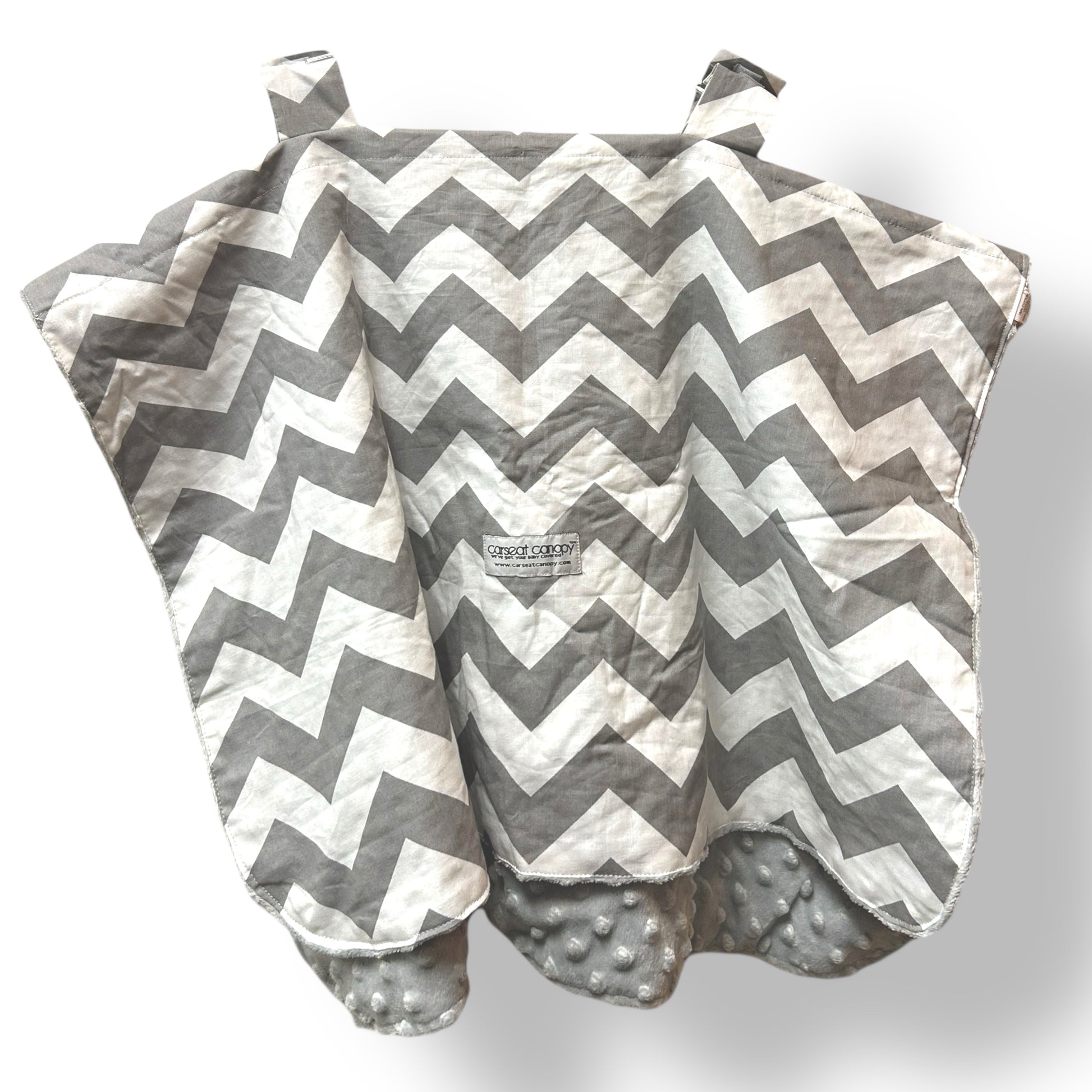 Gray and white chevron-patterned baby blanket with textured surface on a white background