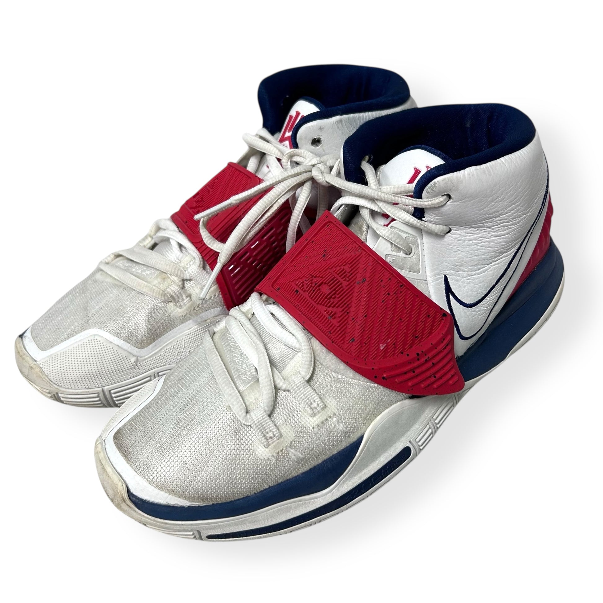 White sneakers with red and blue accents on a white background