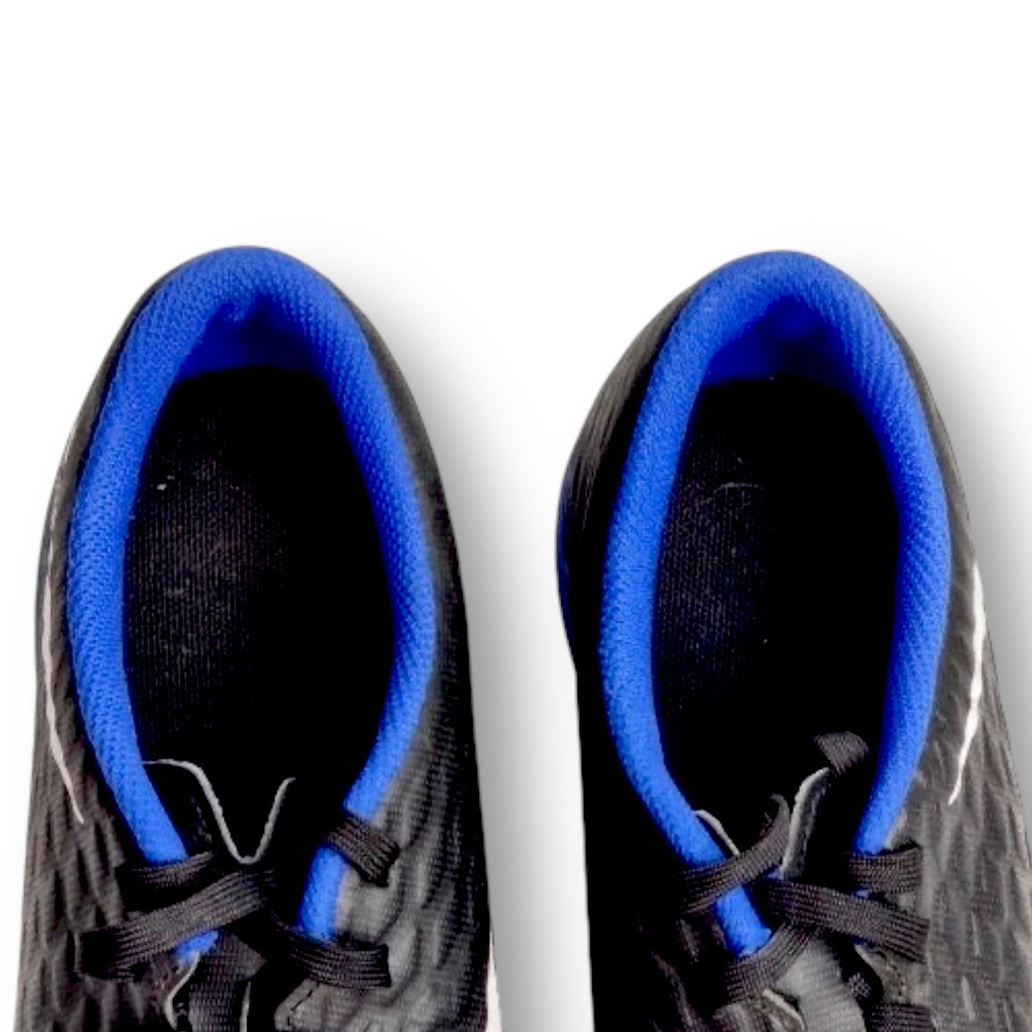 Black athletic shoes with blue lining on a white background