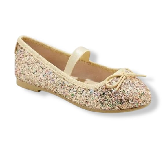 Glittery flat shoe with a bow on a white background