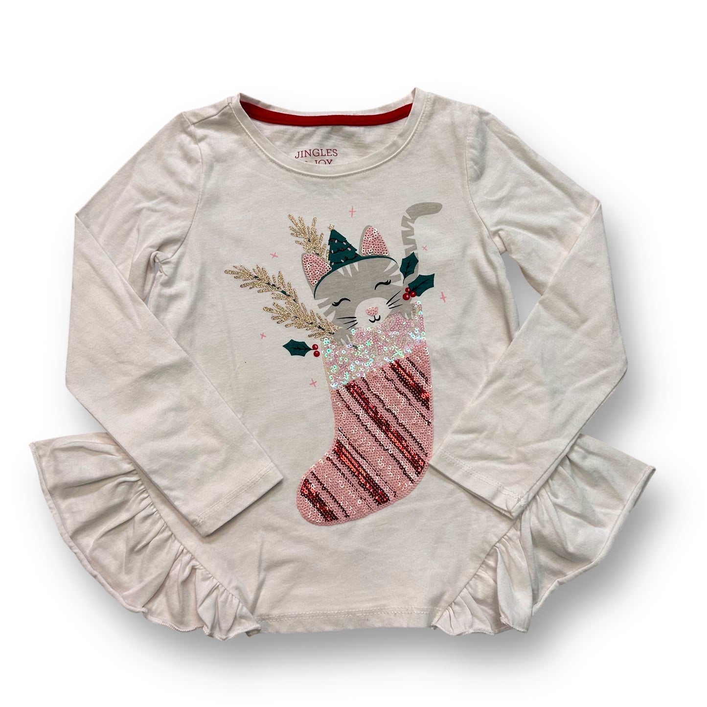 A girls' white long-sleeve shirt with a sequined kitty candy cane design and red and green holiday pattern on the sleeves.