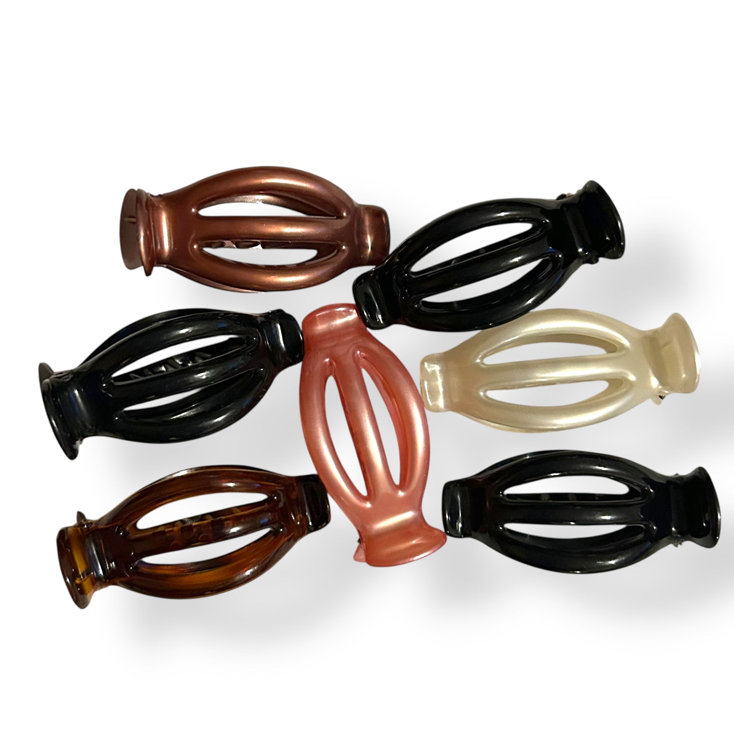 Set of six hair clips in various colors on a white background