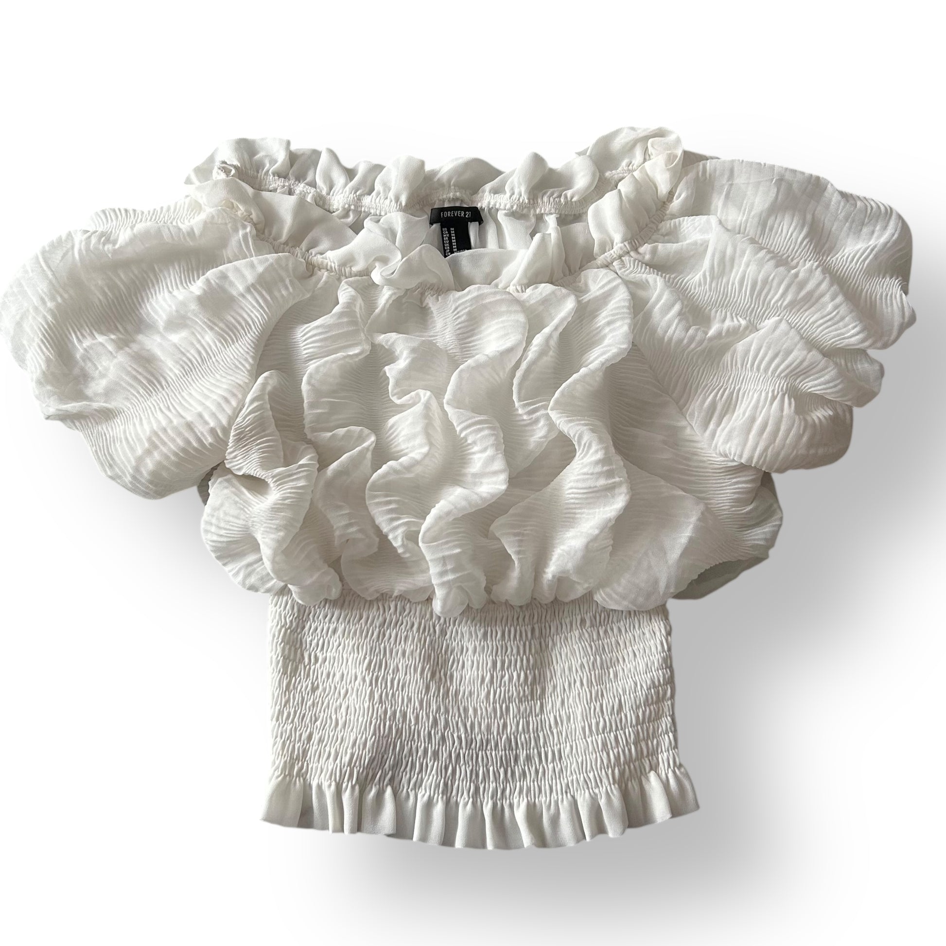White ruffled top on a white background