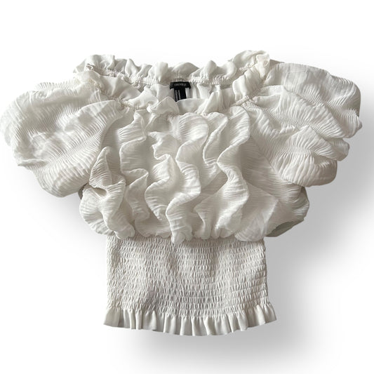 White ruffled top on a white background
