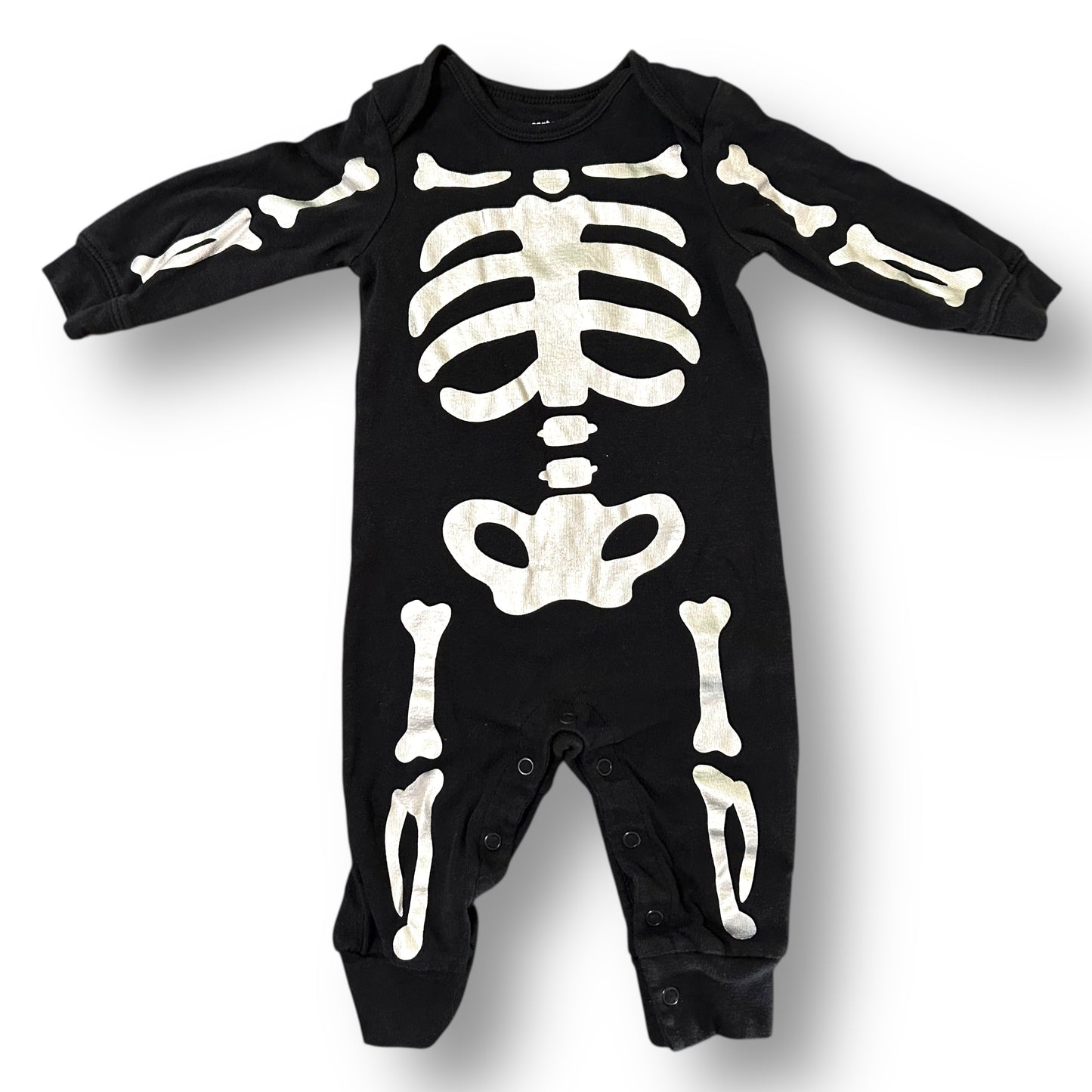 Black baby onesie with skeleton design on a white background