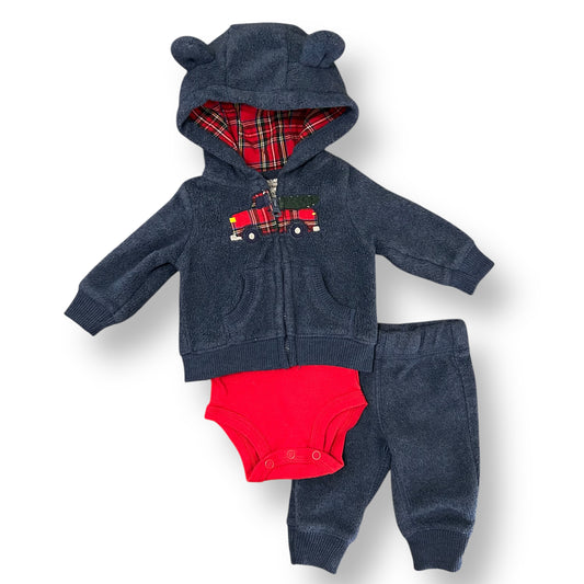 Baby outfit set with navy hoodie, red diaper, and pants on a white background