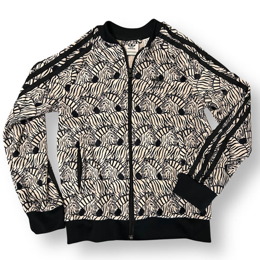 Zebra patterned jacket with black accents on a white background
