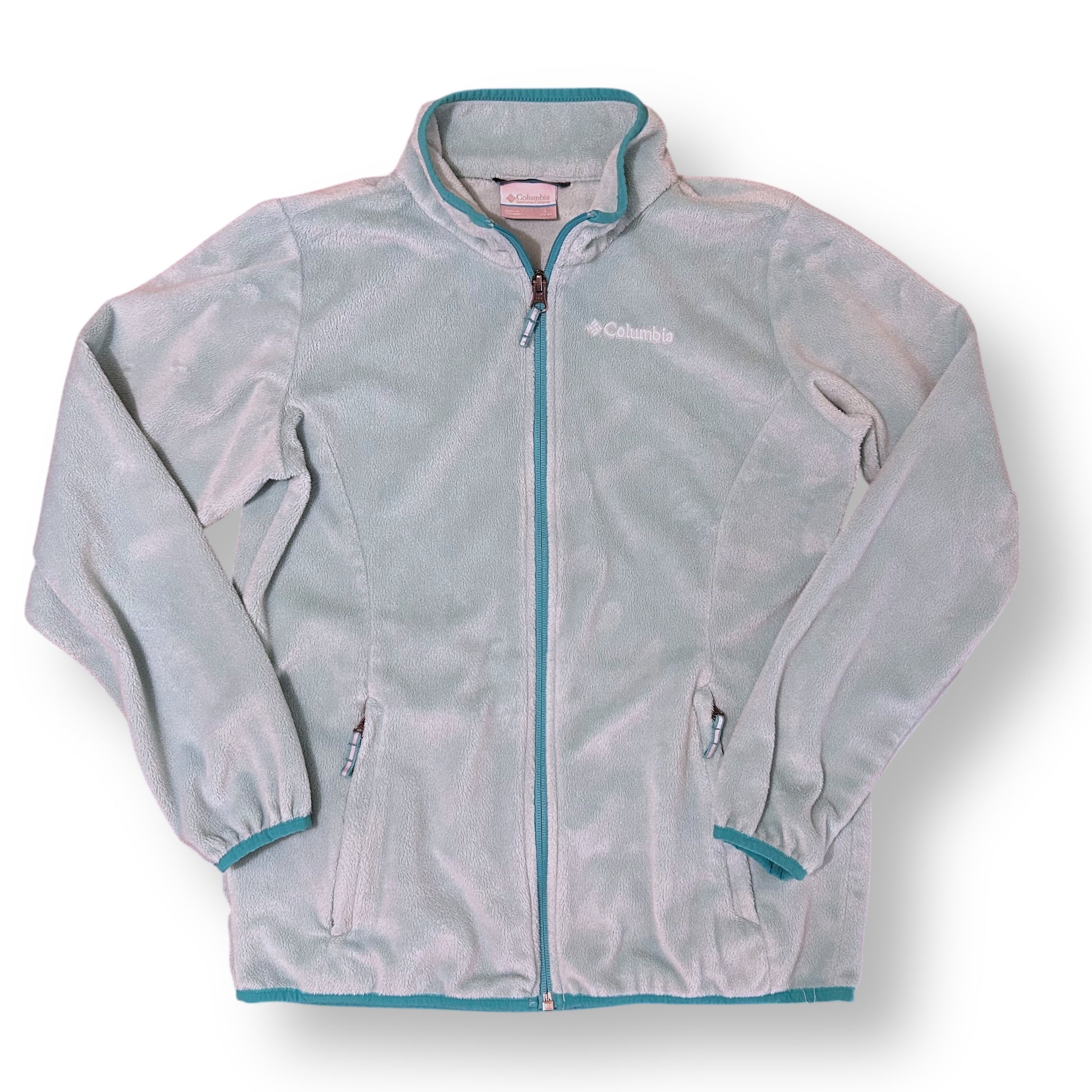 Light blue fleece jacket with teal accents on a white background