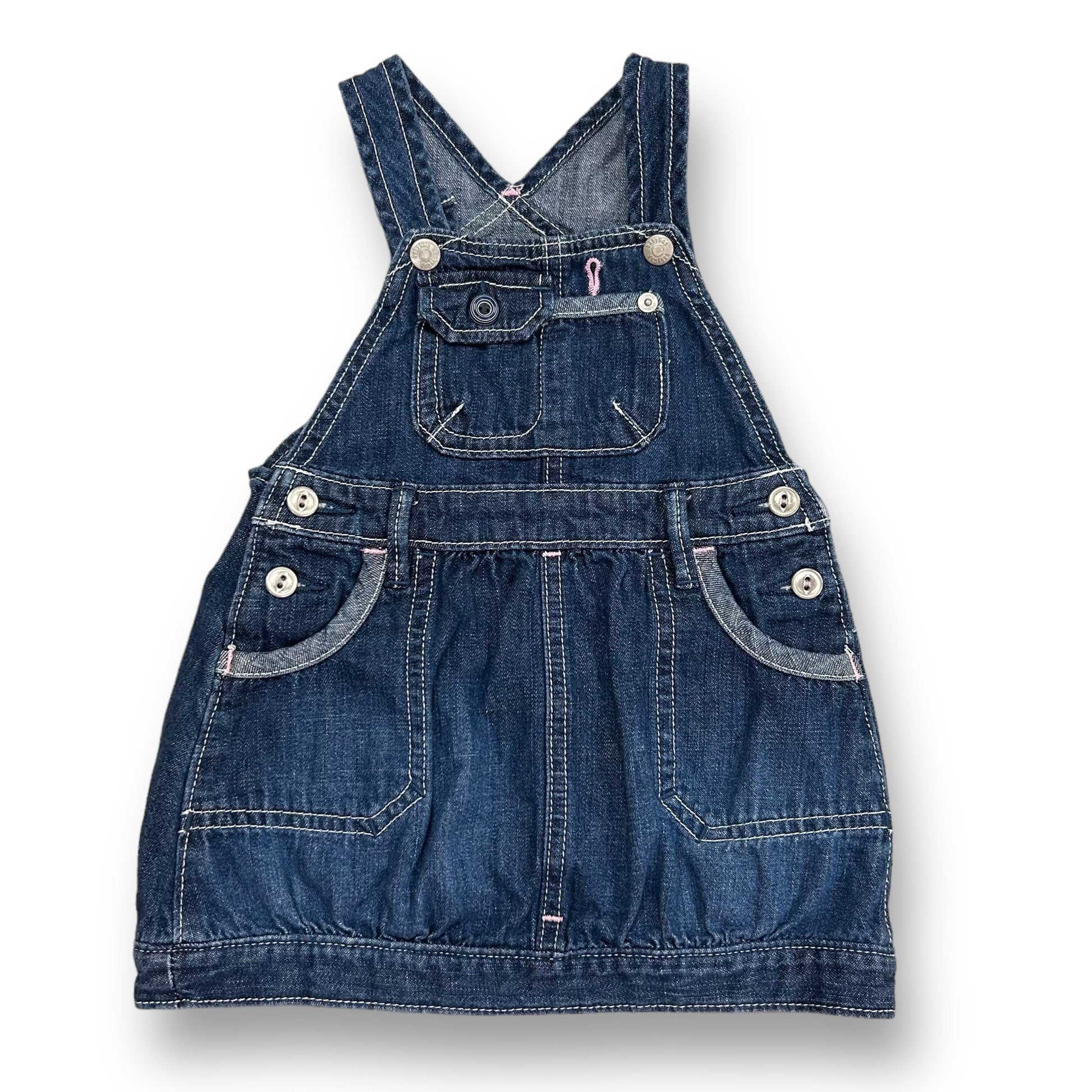 A denim jumper for baby girls, with a small round neckline, short sleeves, and a straight-legged design.